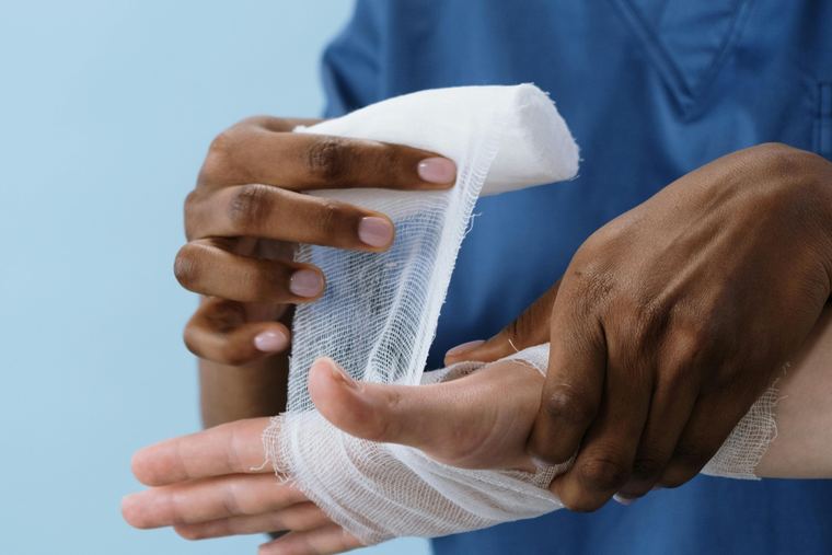 Clinician treating an injured hand