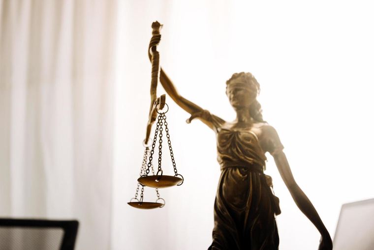 Scales of justice on an attorney's desk
